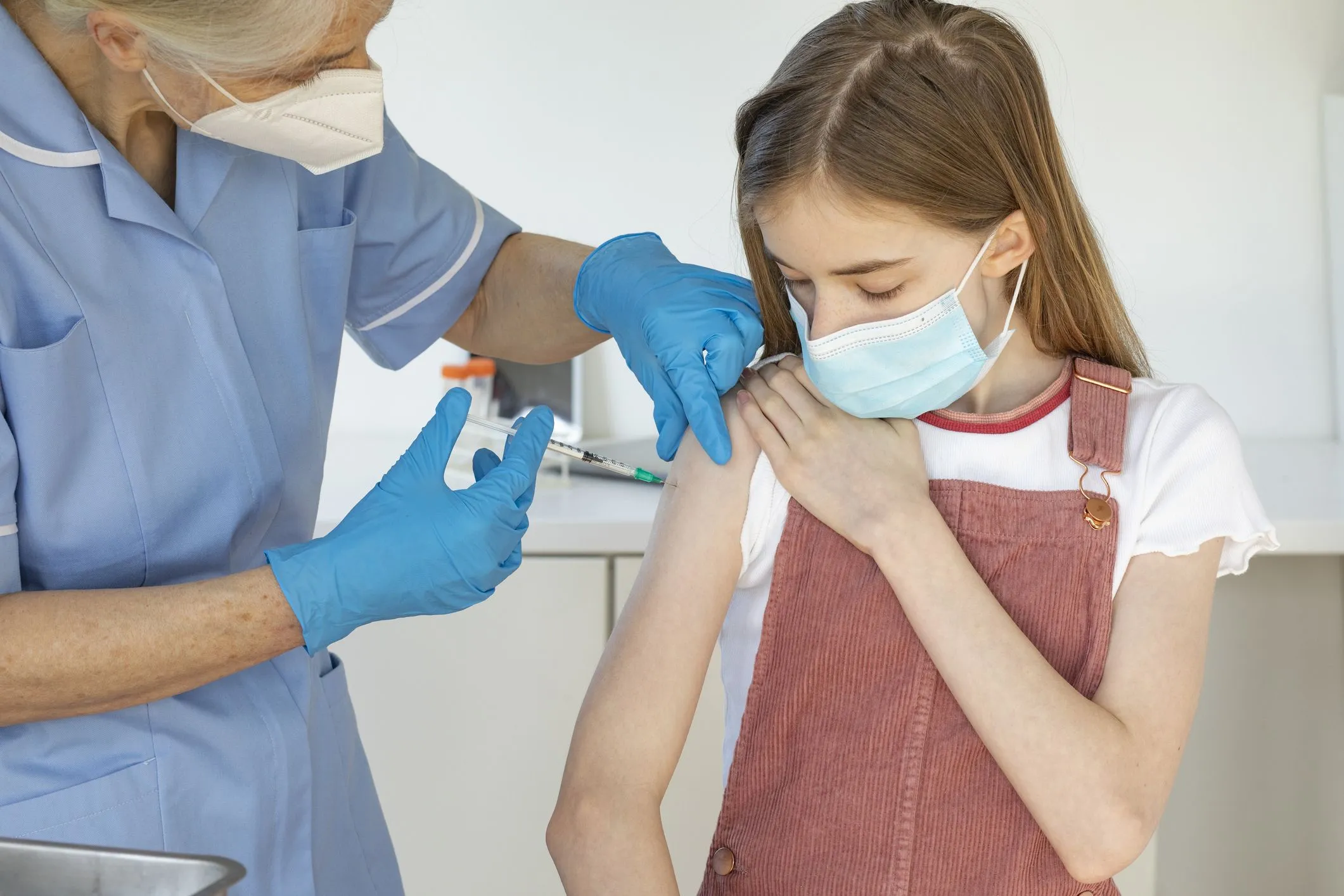 mature-nurse-giving-out-covid-vaccine-royalty-free-image-1632493275.webp